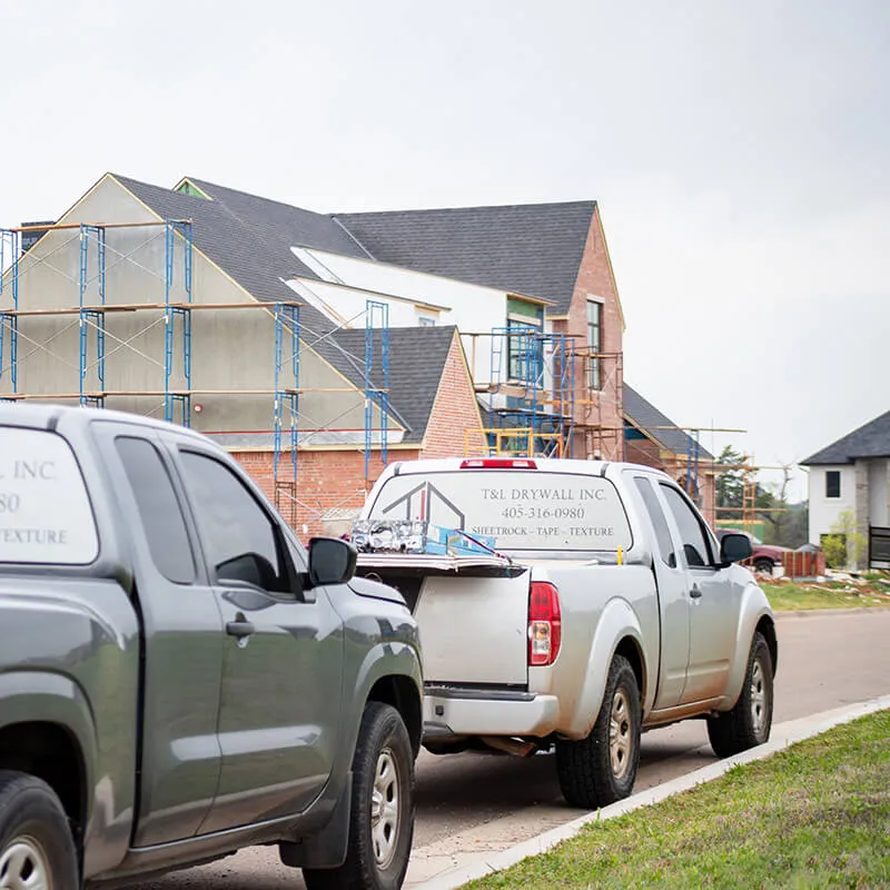 TL Trucks at Site T&L Drywall & Construction trucks at site